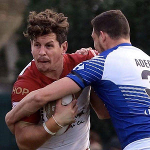 Greg Bird, NRL legend carrying the ball while playing rugby league