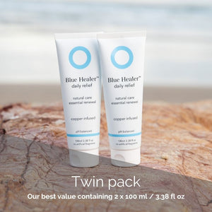 A Blue Healer Care Twin Pack features two full-sized products, shown here on a sandstone beach rock.